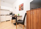 Galley kitchen with dining area